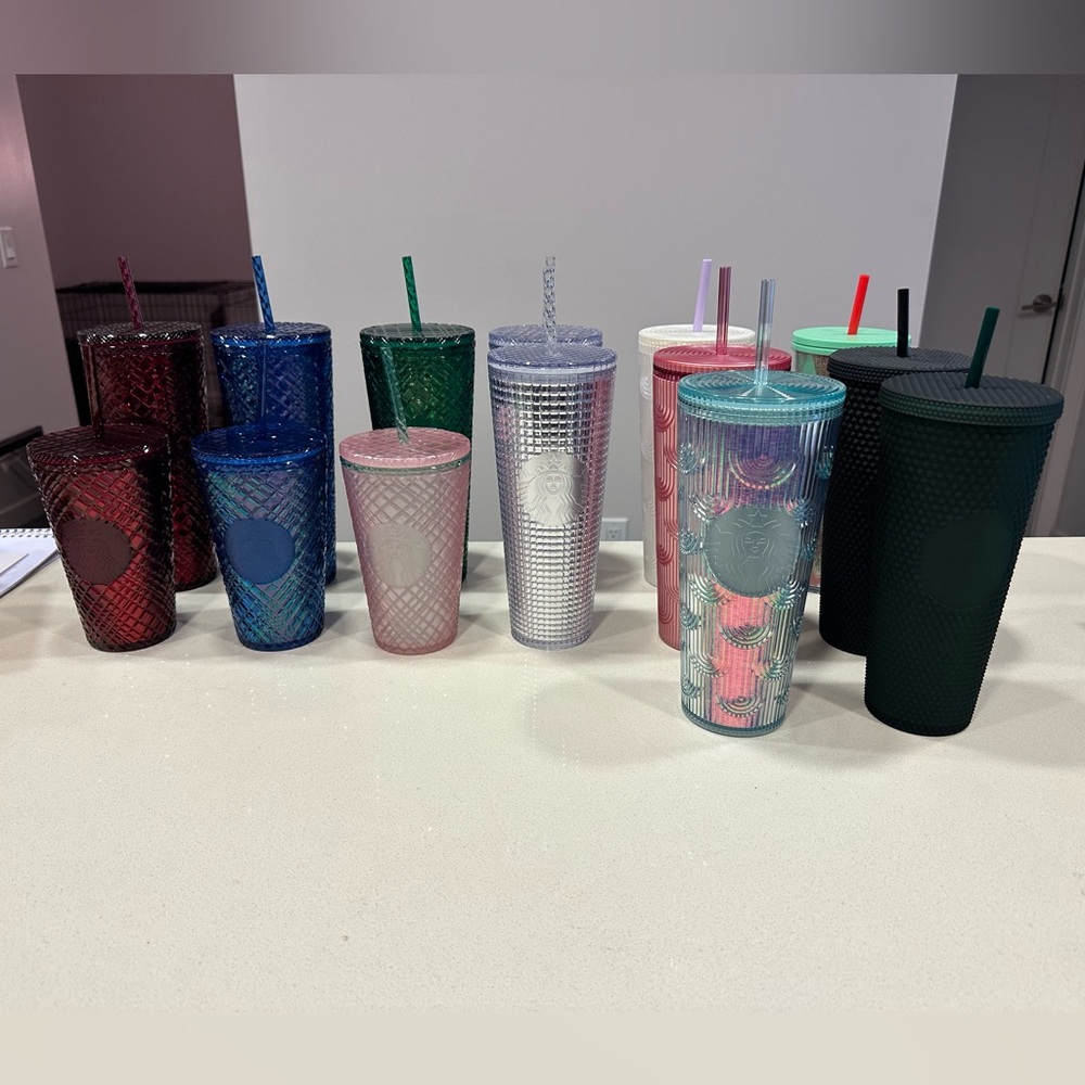 Brand new majority with tags Starbucks Cups.